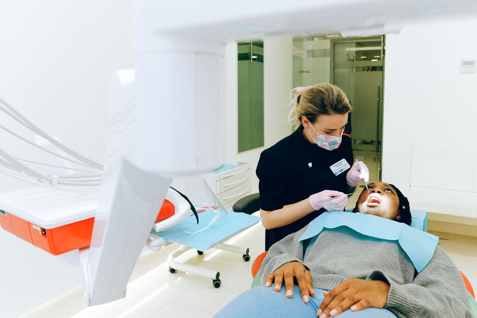 Dental clinician performing periodontal instrumentation

A dentist examines a patient’s mouth with dental instruments in a modern clinic.